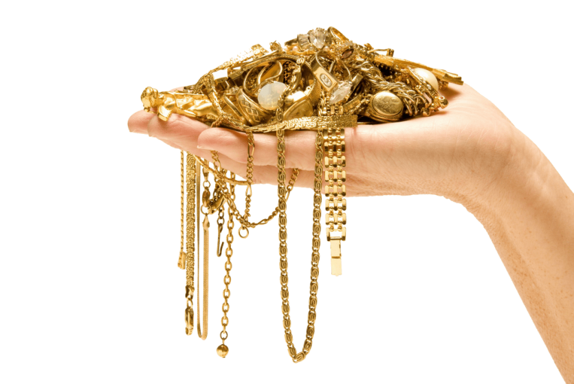 Hand holding gold jewellery poster